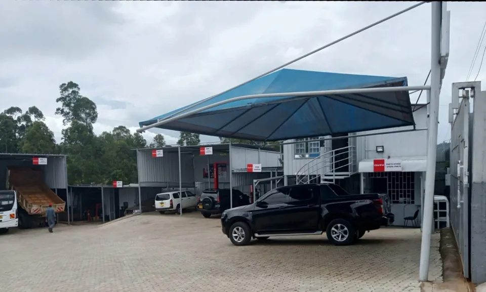 Covered parking. Shaded bays in front of the workshop